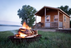 Bonfire in front of a cabin