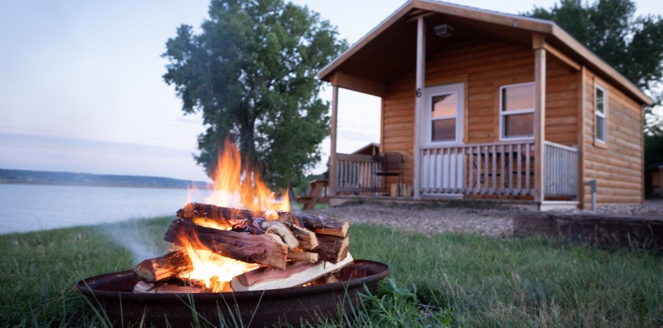 Bonfire in front of a cabin