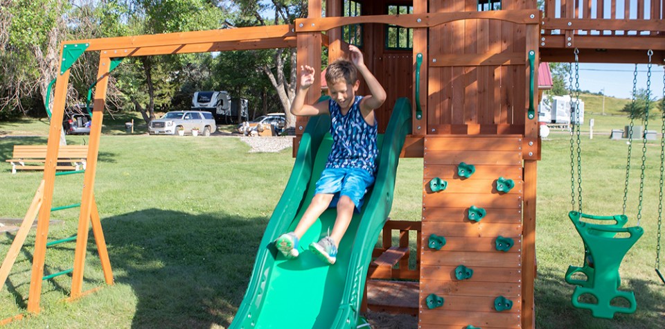 Boy going down the slide