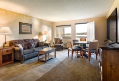 Sofa and Chair in room with deck