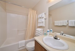 Bathroom with shower/tub combo, toilet, and sink
