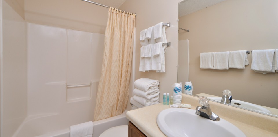 Bathroom with shower/tub combo, toilet, and sink