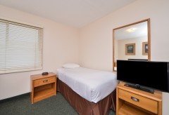 Single Bed with tv and two nightstands
