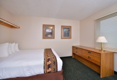 Queen Bed with dresser and clothing bar