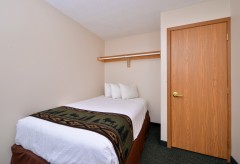 Single Bed room with clothing rod