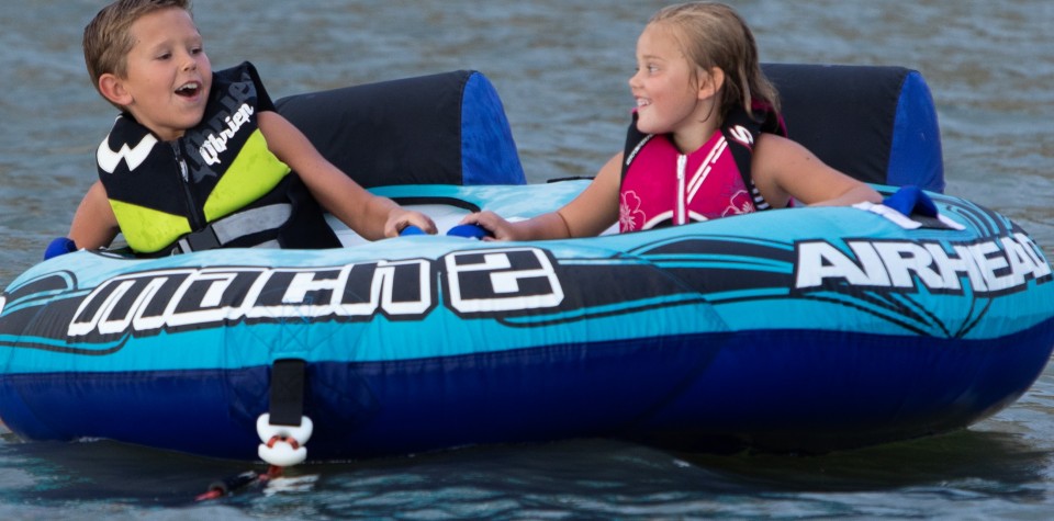 Kids on a tube in the water
